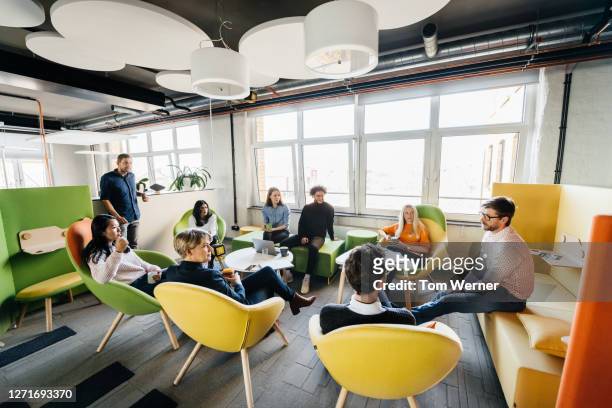 seminar between team in modern office - new business stock pictures, royalty-free photos & images