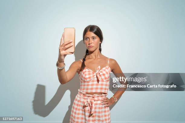 young woman take a selfie - fashion shoot stock-fotos und bilder