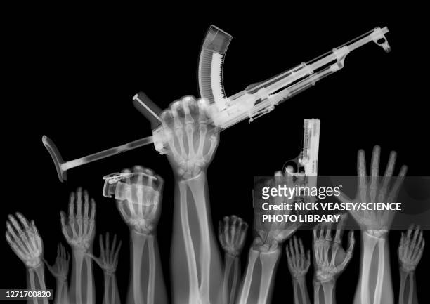 hands of protesters with guns, x-ray - terrorism stock pictures, royalty-free photos & images