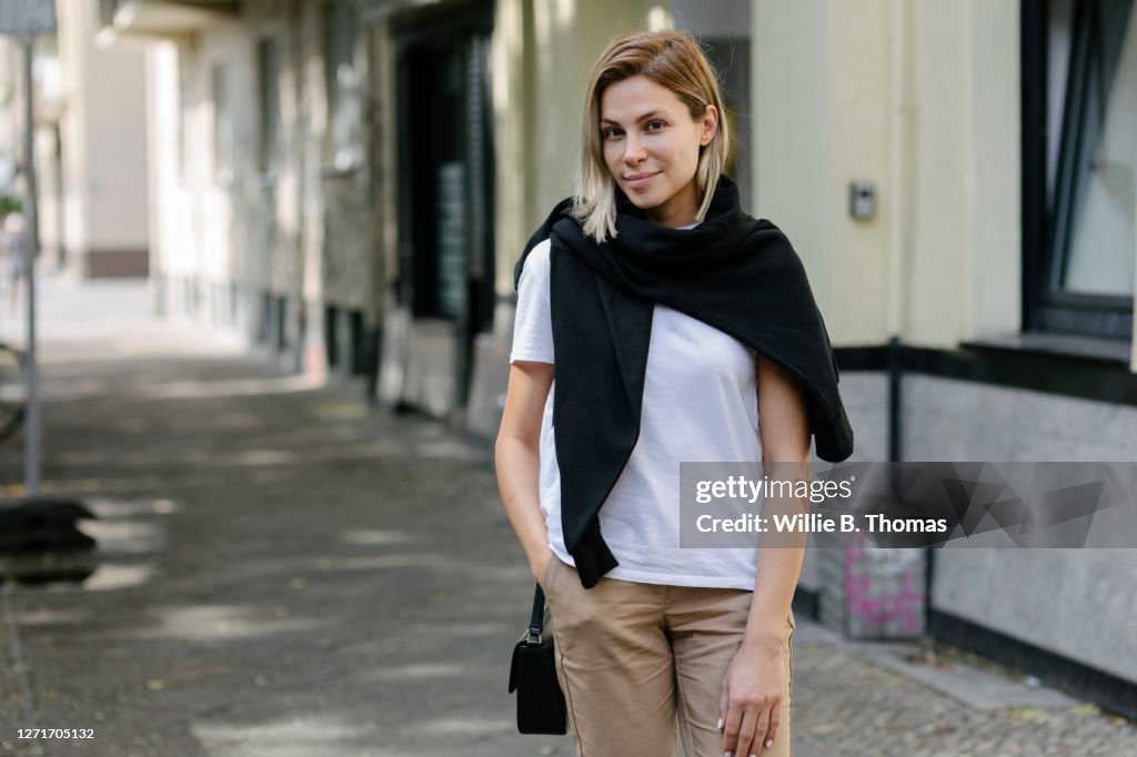 Young young woman in her city neighborhood