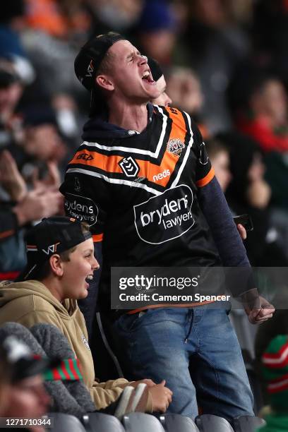 Tigers fans cheers during the round 18 NRL match between the Wests Tigers and the South Sydney Rabbitohs at Bankwest Stadium on September 10, 2020 in...