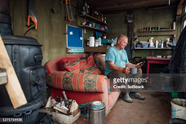 taking a rest in the workshop - shed stock pictures, royalty-free photos & images