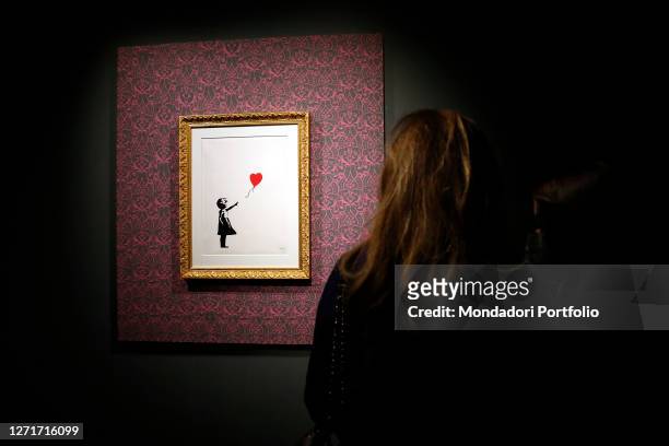 Exhibition of the artist Bansky, titled A visual Protest, at Chiostro del Bramante in Rome. In the picture the painting Girl with the balloon. Rome ,...