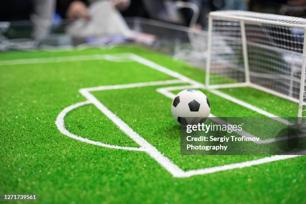 soccer ball on the playing field - ball on a table stock-fotos und bilder