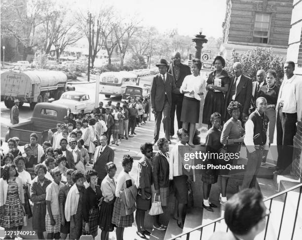 View of a line of people was they wait to register to vote, Macon, Georgia, 1962.