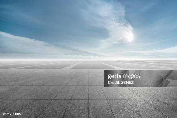 empty parking lot - dramatic sky road stock pictures, royalty-free photos & images