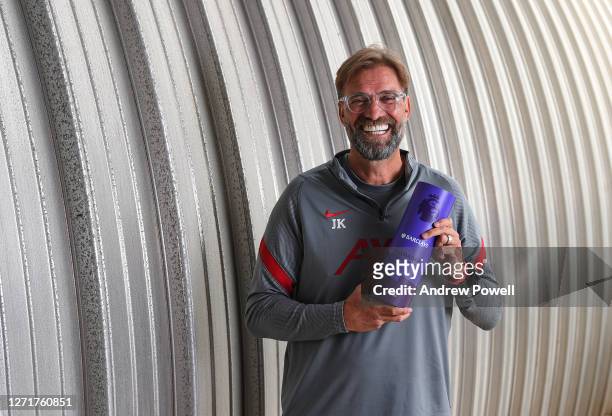 Jurgen Klopp manager of Liverpool with the Premier League Manager of the Year award at Melwood Training Ground on September 10, 2020 in Liverpool,...