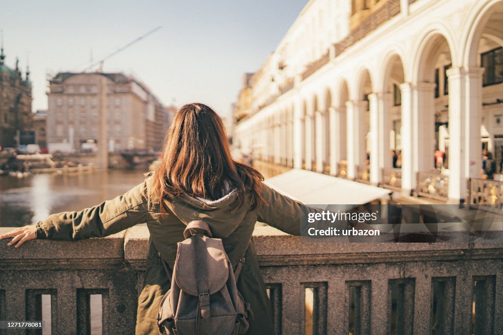 Female tourist enjoying view from bridge