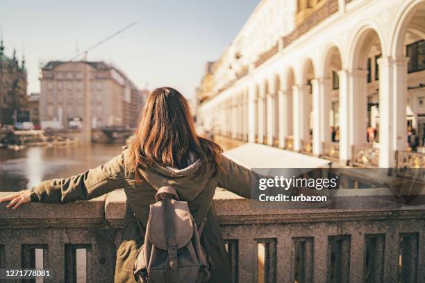 female tourist enjoying view from bridge - hamburg stock pictures, royalty-free photos & images