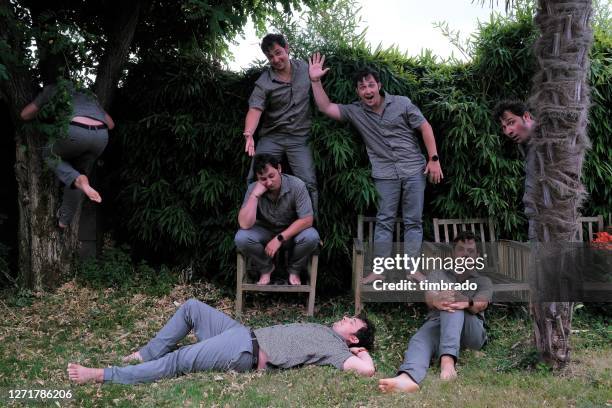 multiple exposure shot of a man in a garden, france - clonación fotografías e imágenes de stock