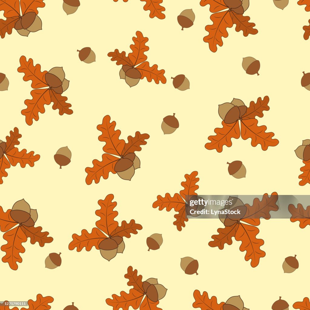 Seamless vector autumn pattern with leaves and acorns. Natural forest design
