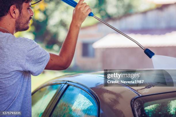 self service car wash - close up of a cleansing spray nozzle stock pictures, royalty-free photos & images