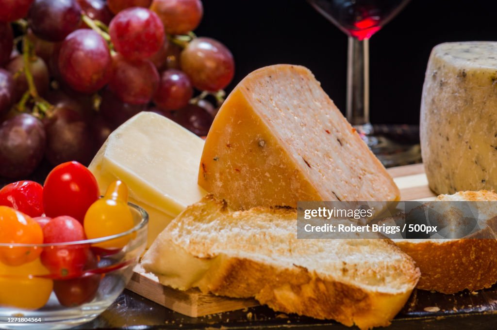 Close-Up Of Cheese With Vegetables On Table
