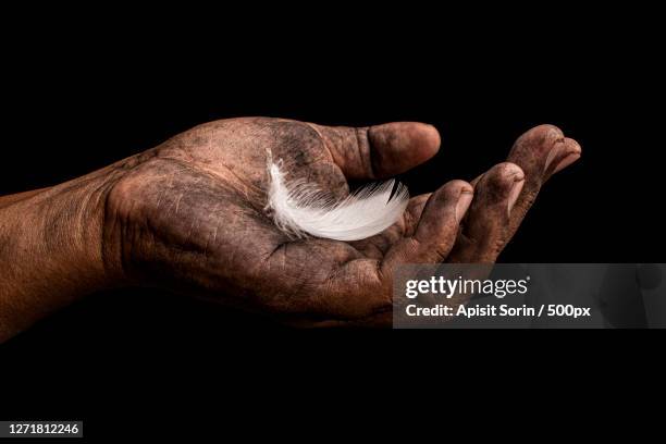 cropped hand of person with dirty hand against black background - apisit sorin stock pictures, royalty-free photos & images