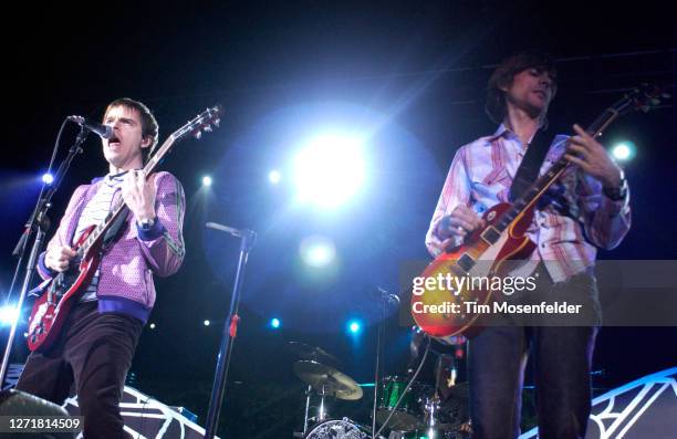 Rivers Cuomo and Brian Bell of Weezer perform during KROQ's Inland Invasion 5 at Hyundai Pavilion on September 17, 2005 in Glen Helen, California.