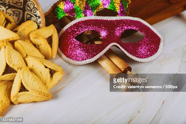 high angle view of mask and decorations on table - happy purim stock pictures, royalty-free photos & images