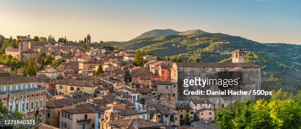high angle view of townscape against sky, perugia, italy - italië stock-fotos und bilder