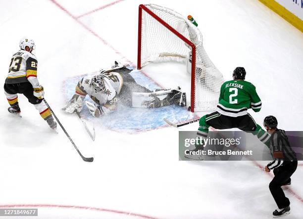 Jamie Oleksiak of the Dallas Stars scores a goal past Robin Lehner of the Vegas Golden Knights during the second period in Game Three of the Western...