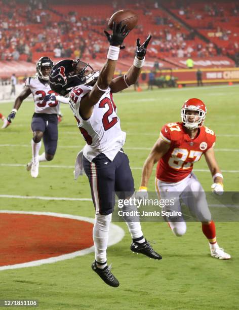 Vernon Hargreaves III of the Houston Texans tries unsuccessfully to intercept the ball in the end zone against Travis Kelce of the Kansas City Chiefs...