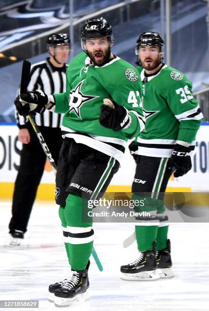Alexander Radulov of the Dallas Stars reacts after scoring the game-winning overtime goal for the 3-2 win as Joel Hanley looks on in Game Three of...