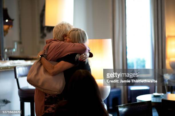 Samantha Fox and Denise Welch hug during the "Henpire" podcast launch event at Langham Hotel on September 10, 2020 in London, England.