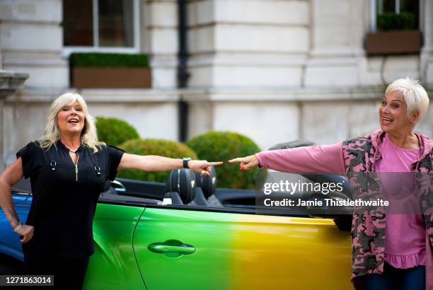 Samantha Fox and Denise Welch pose with the rainbow Bentley during the "Henpire" podcast launch event at Langham Hotel on September 10, 2020 in...