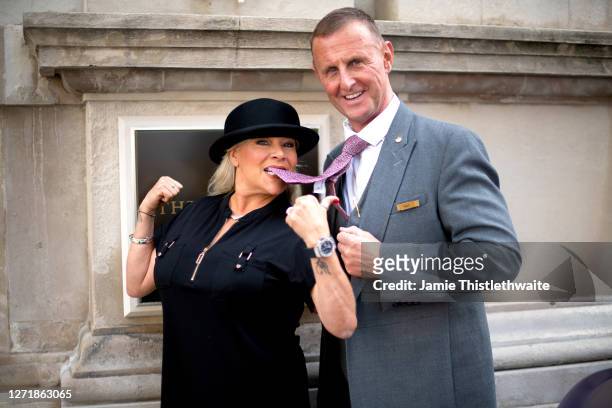 Samantha Fox poses with The Langham doorman during the "Henpire" podcast launch event at Langham Hotel on September 10, 2020 in London, England.