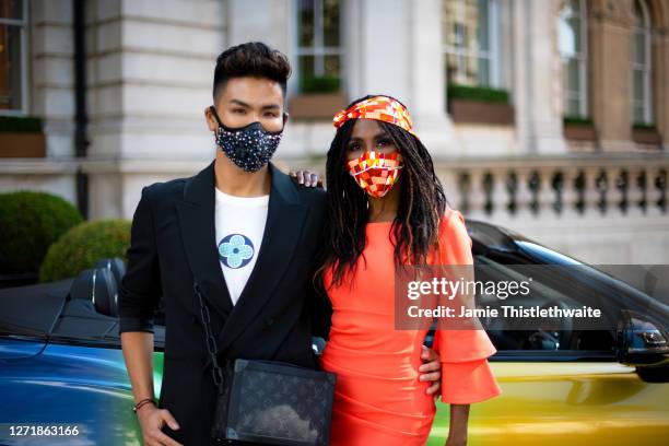 Vincent Wong and Sinitta pose with the rainbow Bentley during the "Henpire" podcast launch event at Langham Hotel on September 10, 2020 in London,...