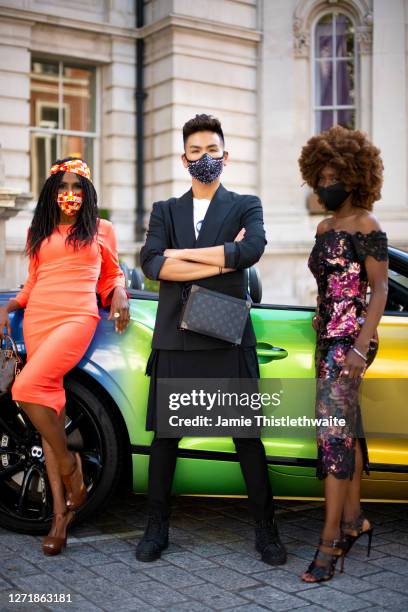 Sinitta, Heather Small and Vincent Wong pose with the rainbow Bentley during the "Henpire" podcast launch event at Langham Hotel on September 10,...