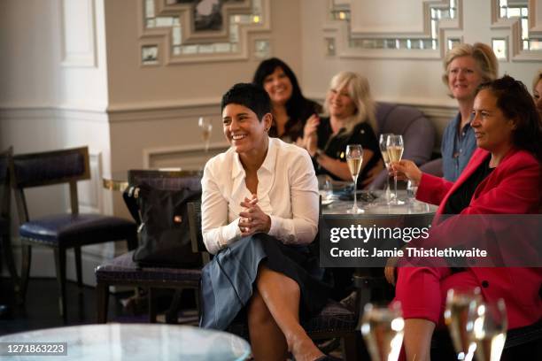 Susie Hanlon applauds the Cast and Crew panel during the "Henpire" podcast launch event at Langham Hotel on September 10, 2020 in London, England.