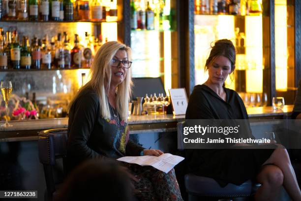 Jacquie Lawrence reads out statistics of Lesbian women in Film and Television on the Cast and Crew panel during the "Henpire" podcast launch event at...