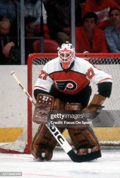 Goalie Ron Hextall of the Philadelphia Flyers defends his goal against the New York Rangers during an NHL Hockey game circa 1987 at Madison Square...
