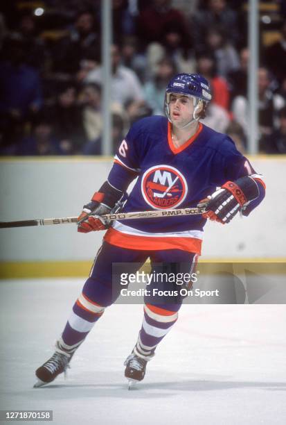 Pat LaFontaine of the New York Islanders skates against the New Jersey Devils during an NHL Hockey game circa 1984 at the Brendan Byrne Arena in East...