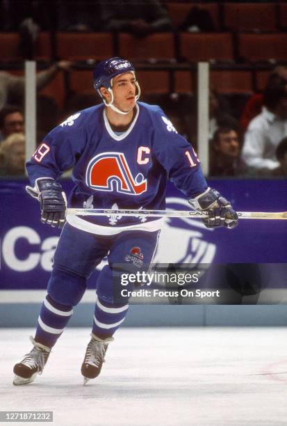 Joe Sakic of the Quebec Nordiques skates against New Jersey Devils during an NHL Hockey game circa 1993 at the Brendan Byrne Arena in East...