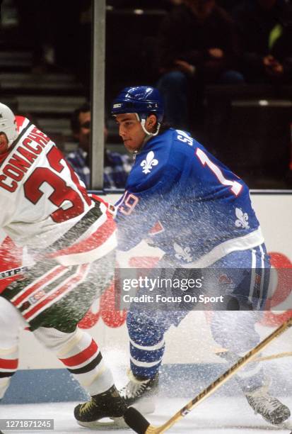 Joe Sakic of the Quebec Nordiques skates against New Jersey Devils during an NHL Hockey game circa 1991 at the Brendan Byrne Arena in East...