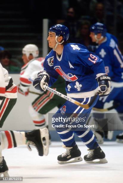 Joe Sakic of the Quebec Nordiques skates against New Jersey Devils during an NHL Hockey game circa 1991 at the Brendan Byrne Arena in East...