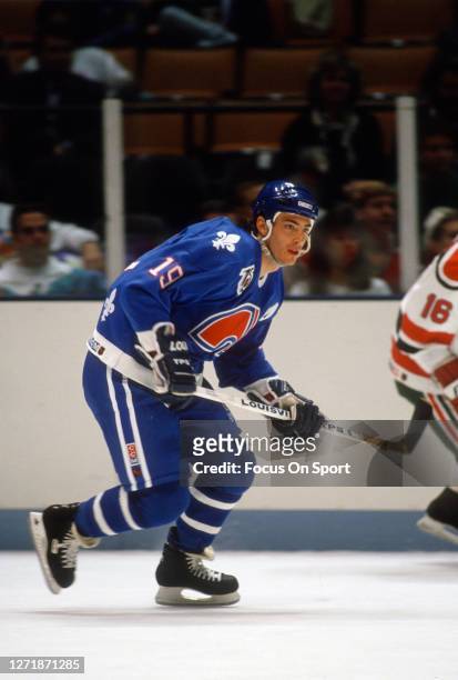 Joe Sakic of the Quebec Nordiques skates against New Jersey Devils during an NHL Hockey game circa 1991 at the Brendan Byrne Arena in East...