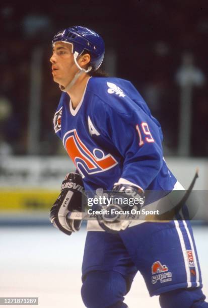 Joe Sakic of the Quebec Nordiques skates against New Jersey Devils during an NHL Hockey game circa 1991 at the Brendan Byrne Arena in East...