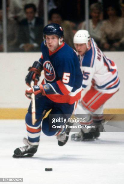 Denis Potvin of the New York Islanders skates against the New York Rangers during an NHL Hockey game circa 1979 at Madison Square Garden in the...