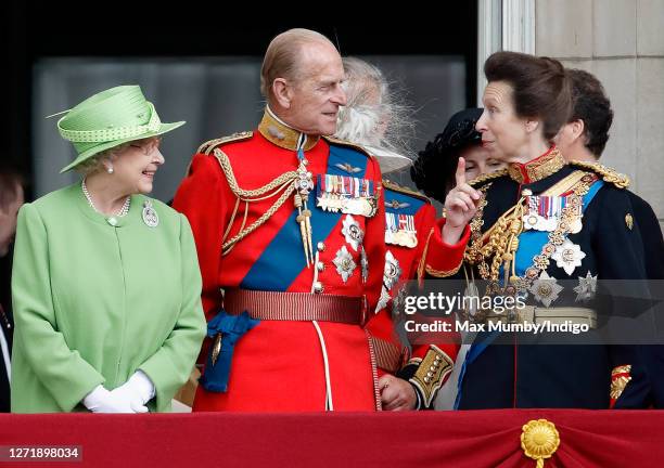 Queen Elizabeth II, Prince Philip, Duke of Edinburgh and Princess Anne, Princess Royal watch a flypast from the balcony of Buckingham Palace during...