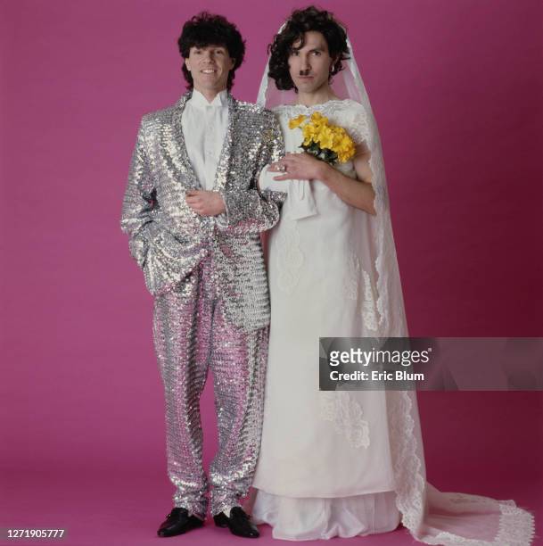 Brothers Russell and Ron Mael of American rock group, Sparks, dressed as a bride and groom, 1982. The shot was used for the cover of their 11th...