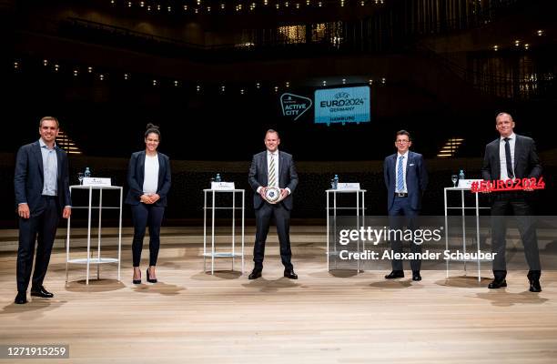 GmbH executive director Philipp Lahm, DFB EURO GmbH special advisor Celia Sasic, Hamburg's Senator for the Interior Andy Grote, UEFA Events SA CEO...