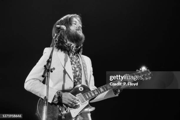 English singer and guitarist Eric Clapton appears in Eric Clapton's Rainbow Concert at the Rainbow Theatre, London, 13th January 1973. He is playing...