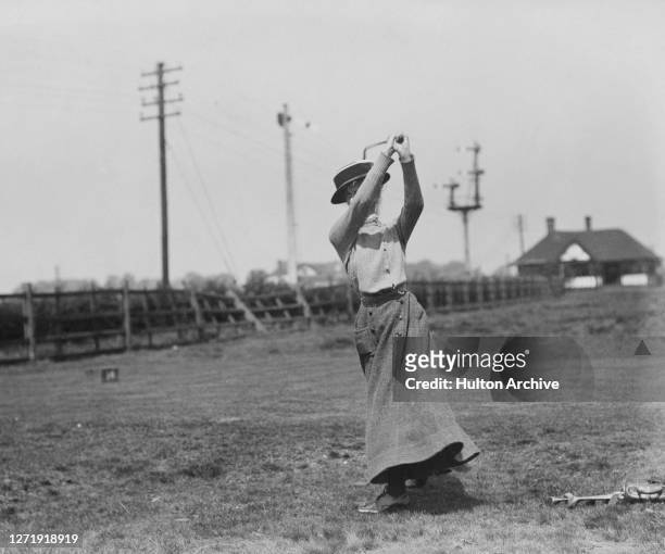 British golfer Mrs Gordon Robertson on the fairway at an unspecified course, 1909.
