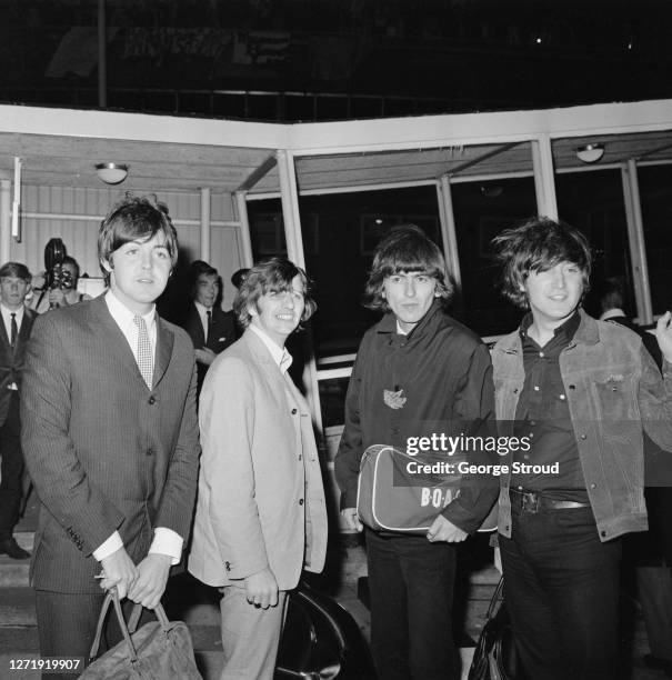 English rock band the Beatles arrive at London Airport from the USA, 2nd September 1965. From left to right, Paul McCartney, Ringo Starr, George...