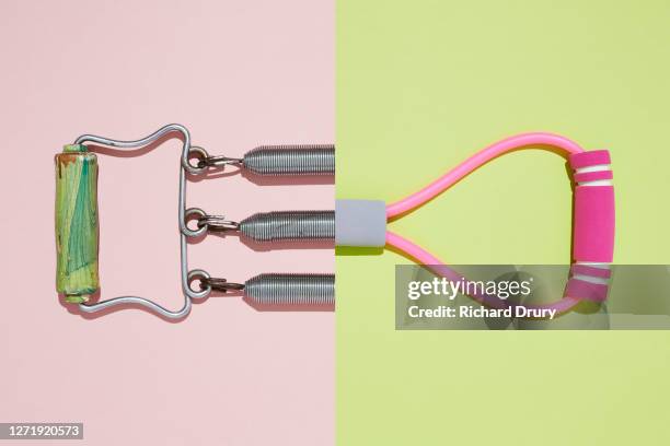 composite image of an old and new chest expander - aparatos para hacer ejercicio fotografías e imágenes de stock