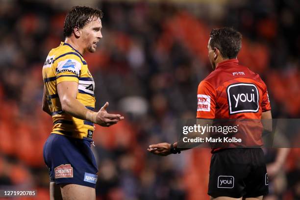 Clinton Gutherson of the Eels talks to referee Gerard Sutton during the round 18 NRL match between the Penrith Panthers and the Parramatta Eels at...