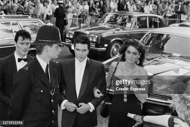 Singer Simon Le Bon of the band Duran Duran with his girlfriend, actress Claire Stansfield, at the premiere of the James Bond film 'A View to a...