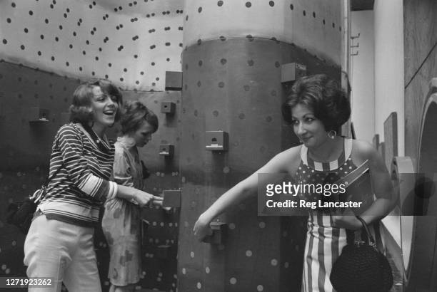Visitors experiencing a tactile room full of finger boxes by Japanese artist Ay-O at the 1966 Venice Biennale, Italy, 19th June 1966.