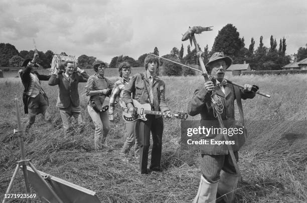 The Spencer Davis Group filming the British musical comedy 'The Ghost Goes Gear' in the countryside, UK, 1966. English actor Jack Haig is at the...